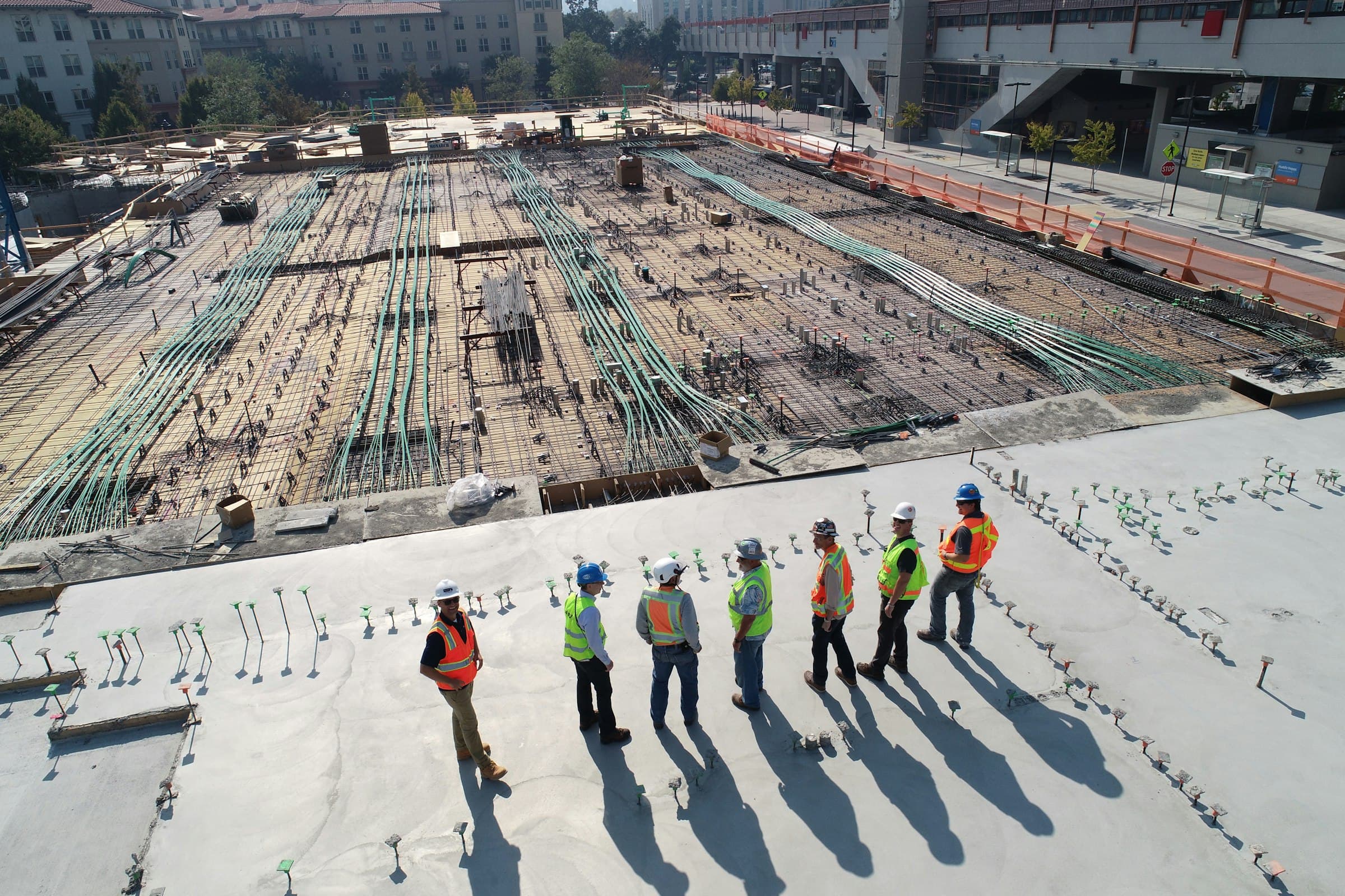 Construction team on a reinforced steel foundation, representing the layered structure of a safety framework